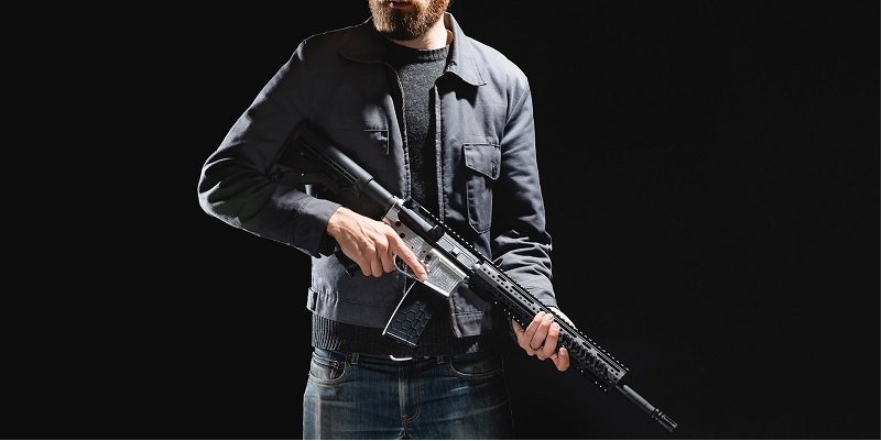 Andy Greenberg, poses with his CNC milled AR15 rifle.  