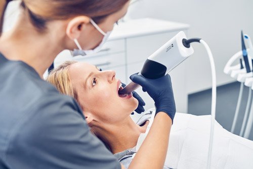 3d scanning a patient's mouth to make oral molds