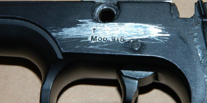 A rifle, with its serial number scratched off.