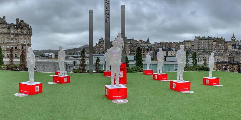 Ten translucent statues, comprising the "Making Blood Cancer Visible" installation.