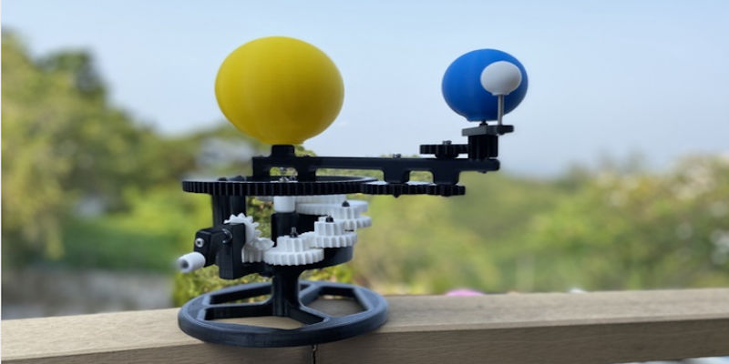 3D printed orrery model with a Sun, Earth, and Moon