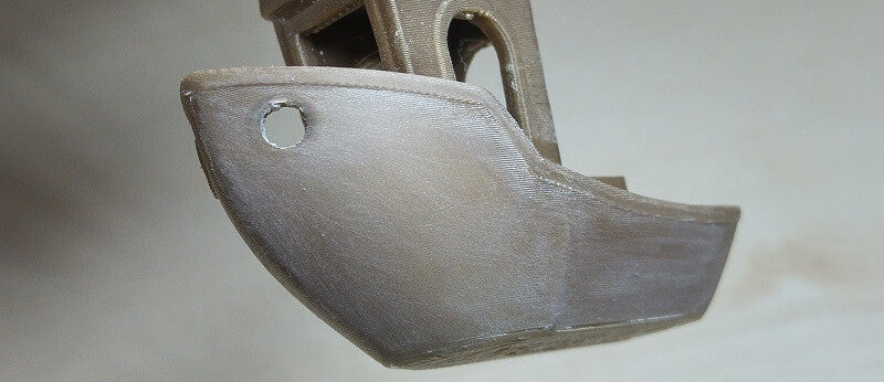 Using 400 grit sandpaper on a 3DBenchy 3D print, until you cannot see the layer lines anymore.